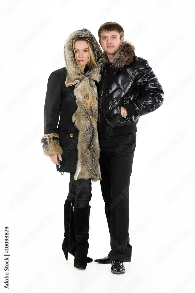 Young woman and man in fur coats Young woman and man in fur coats