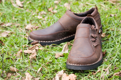 New man's boots from a leather on a background of a grass.Fall. © Stanislav Komogorov