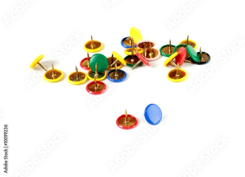 Colorful tacks, isolated on white