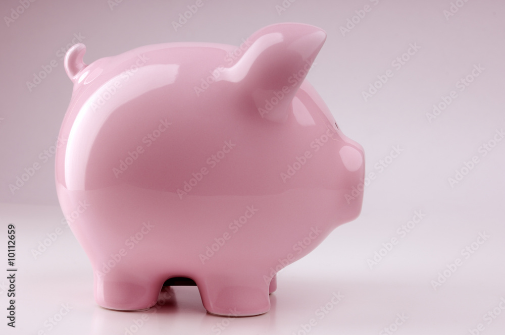 Piggy bank isolated on pink background Piggy bank isolated on pink background