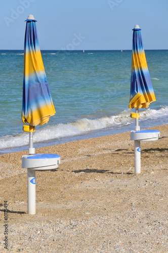 Blue and yellow parasols at the beach