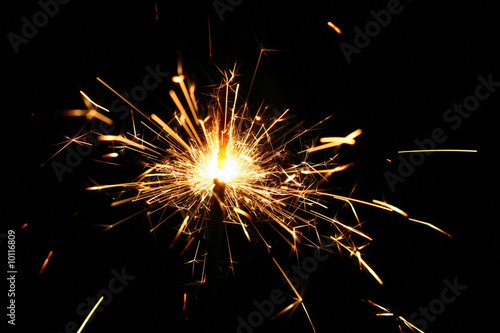 Wallpaper Mural yellow sparkler holiday background on black Torontodigital.ca