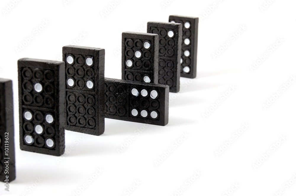 row of dominoes including a special domino stone isolated row of dominoes including a special domino stone isolated