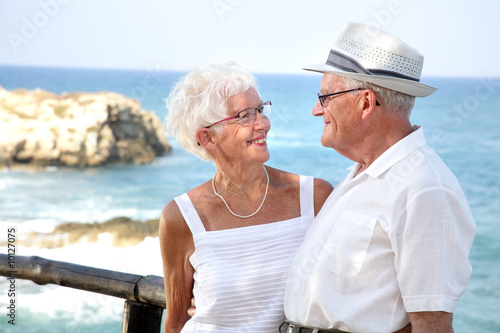 happy elderly couple looking in each other's eyes