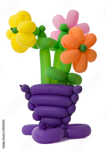 A vase with flowers made of twisted balloons