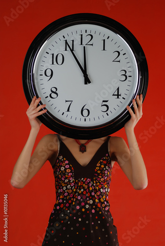 Girl with clock instead of head at red background