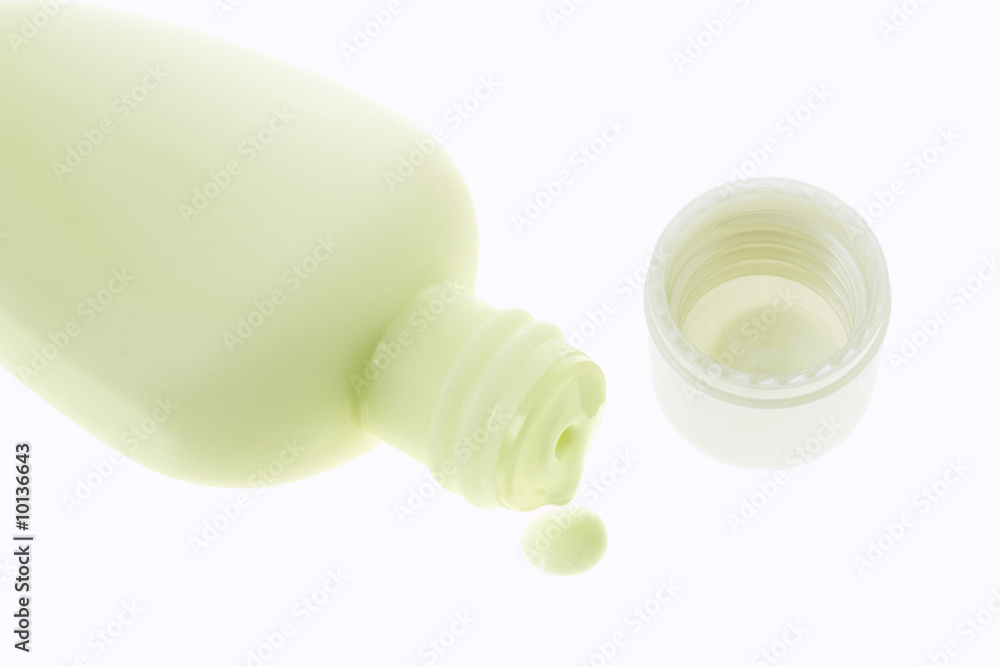 Dripping cosmetic lotion on white background Dripping cosmetic lotion on white background