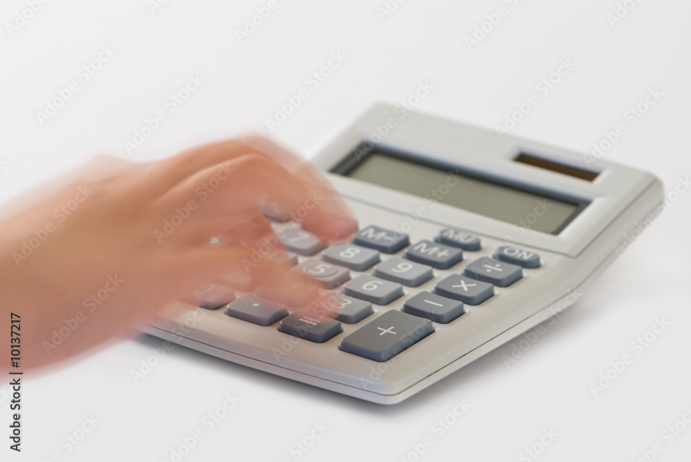 Calculator with blank screen and hand with motion blur Calculator with blank screen and hand with motion blur