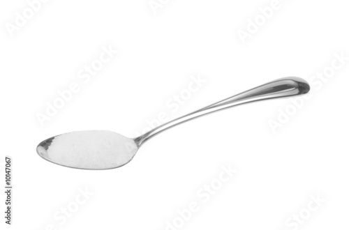 Photography Spoonfull of white sugar isolated on white