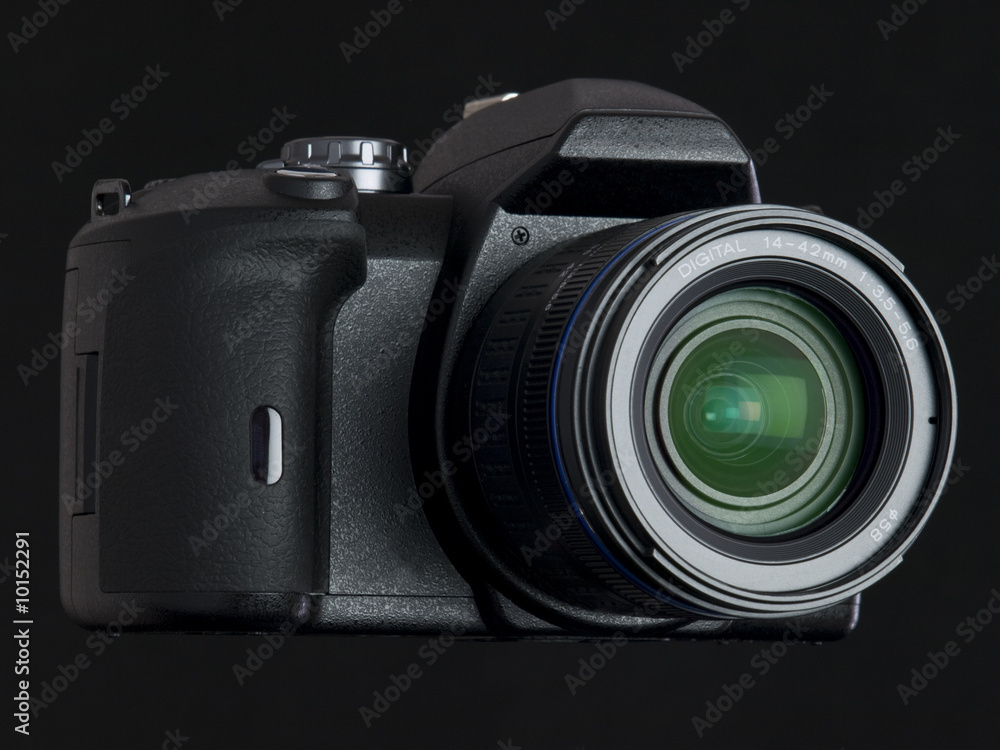 black DSLR with lens front view angle
