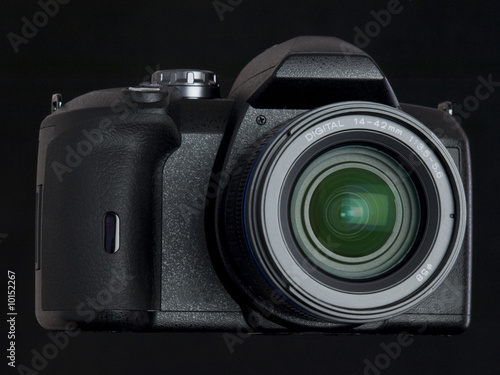 black DSLR with lens front view angle