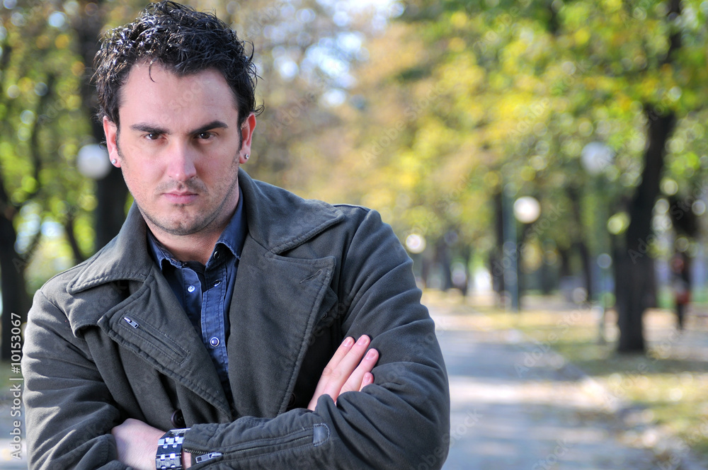happy young casual man outdoor portrait posing