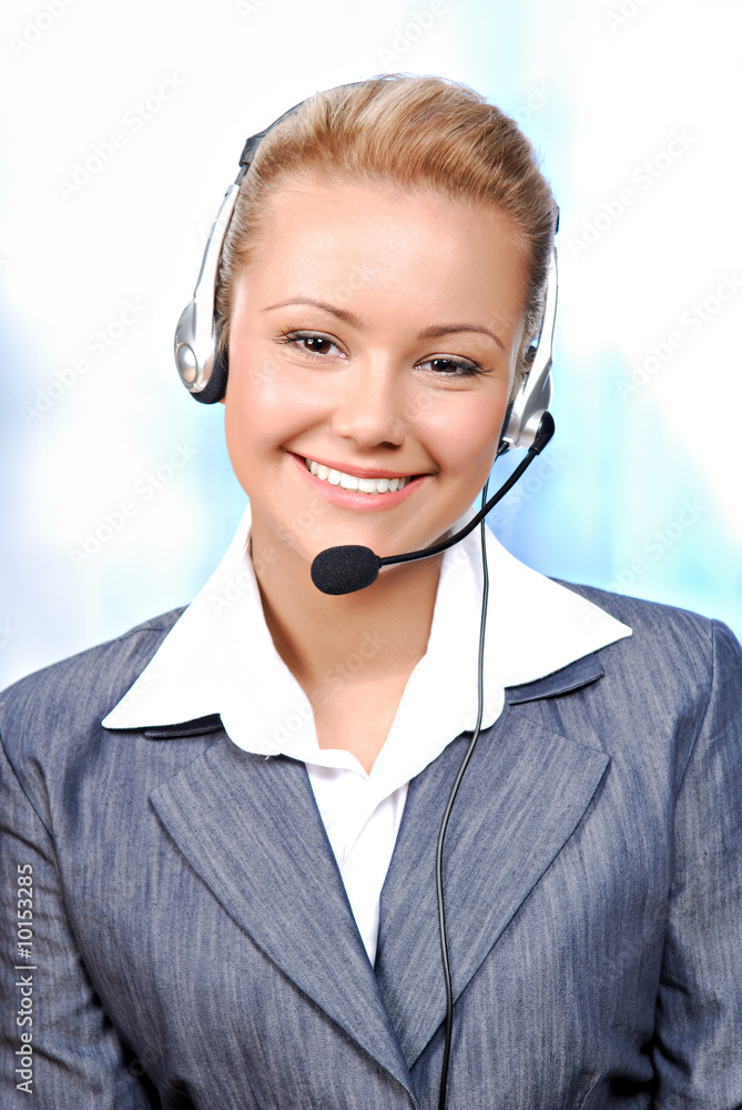 Close-up smiling face of a young female operator Close-up smiling face of a young female operator