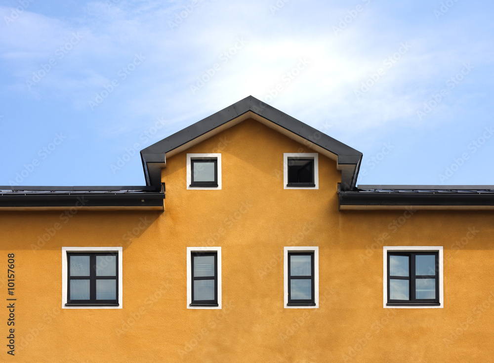 New orange building and blue sky background New orange building and blue sky background