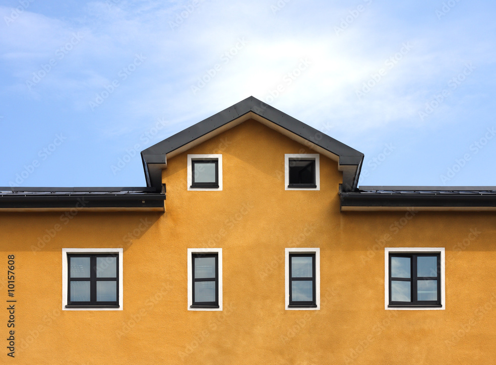 New orange building and blue sky background