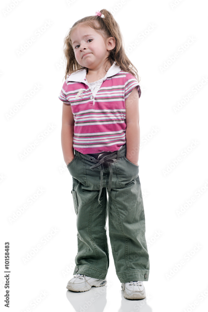 Little girl with rascal expresion, with her hands in her pokets Little girl with rascal expresion, with her hands in her pokets