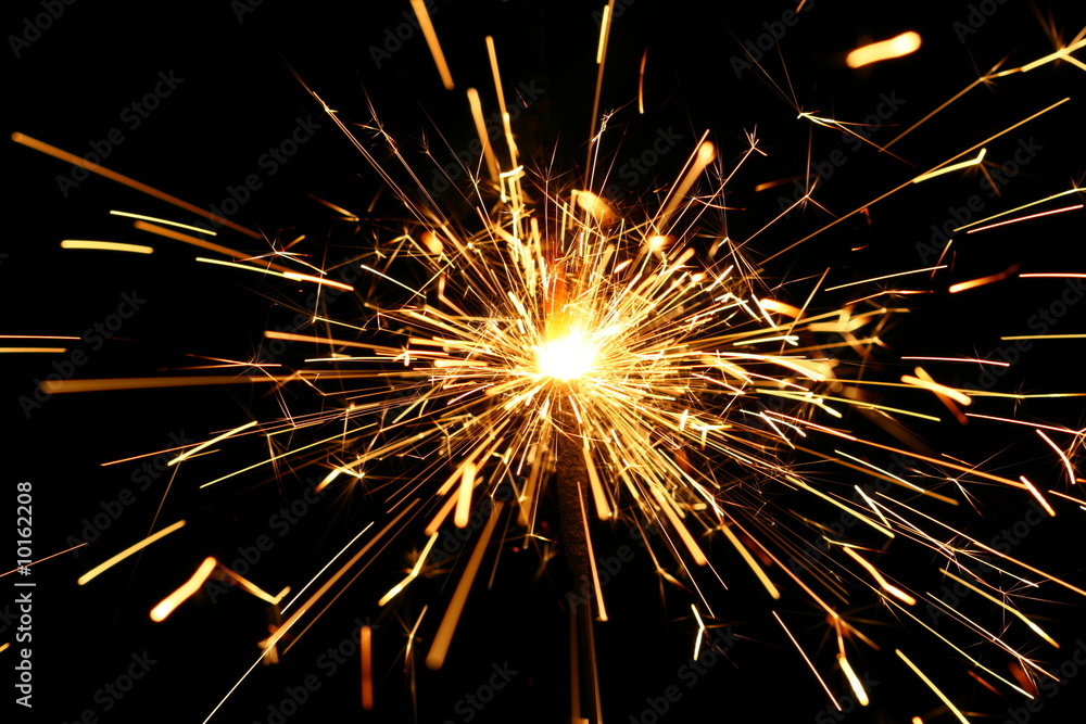 yellow sparkler holiday background on black yellow sparkler holiday background on black
