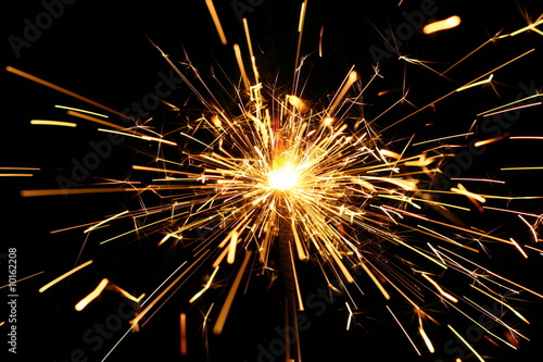 Wallpaper Mural yellow sparkler holiday background on black Torontodigital.ca