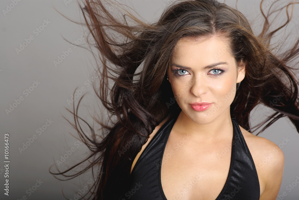 Glamour Portrait of sexy woman on grey background Glamour Portrait of sexy woman on grey background