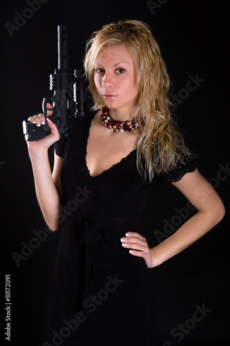 Beautiful girl with the big black pistol