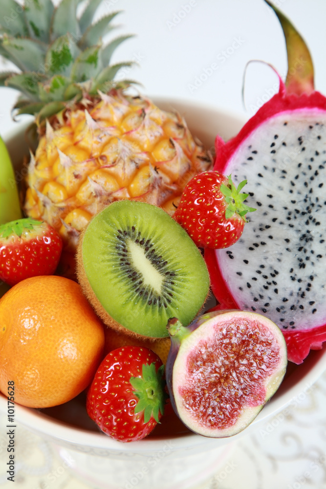 Delicious fresh fruits in bowl as dessert Delicious fresh fruits in bowl as dessert