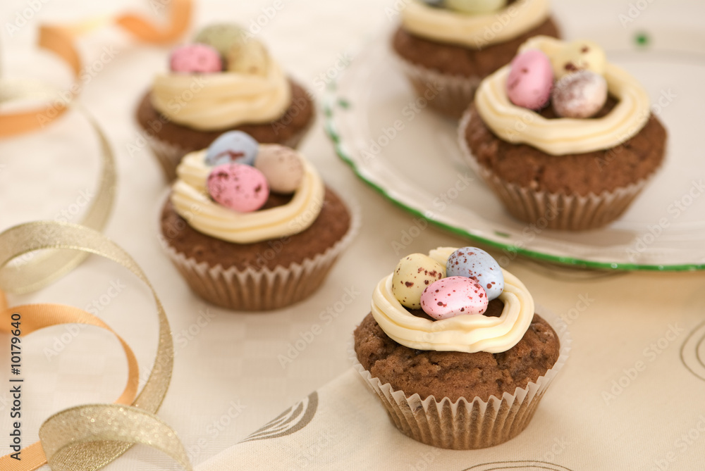 Easter cakes on table with decorative garnishes