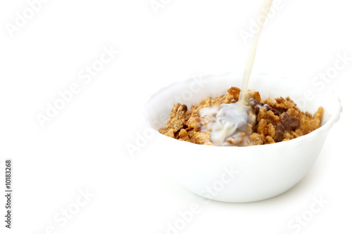 Milk and cereals in a white bowl