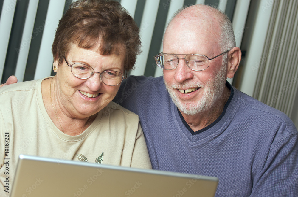 Senior Adults on Working on a Laptop Computer Senior Adults on Working on a Laptop Computer