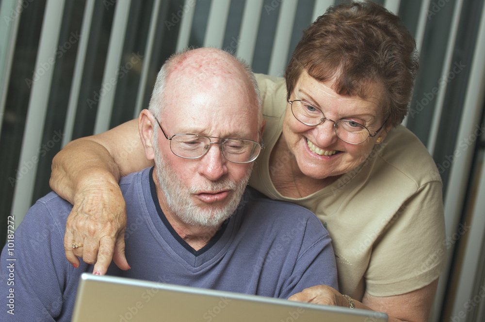 Senior Adults on Working on a Laptop Computer Senior Adults on Working on a Laptop Computer