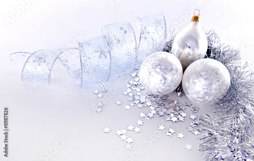beautiful silver seasonal Christmas decorations on background