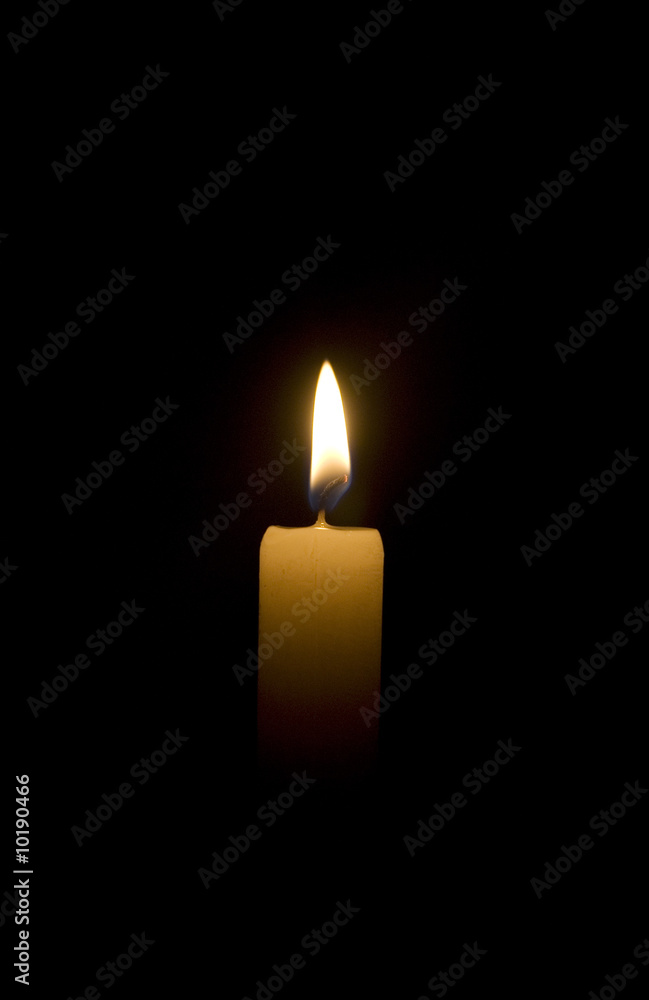 candle flame over black background candle flame over black background