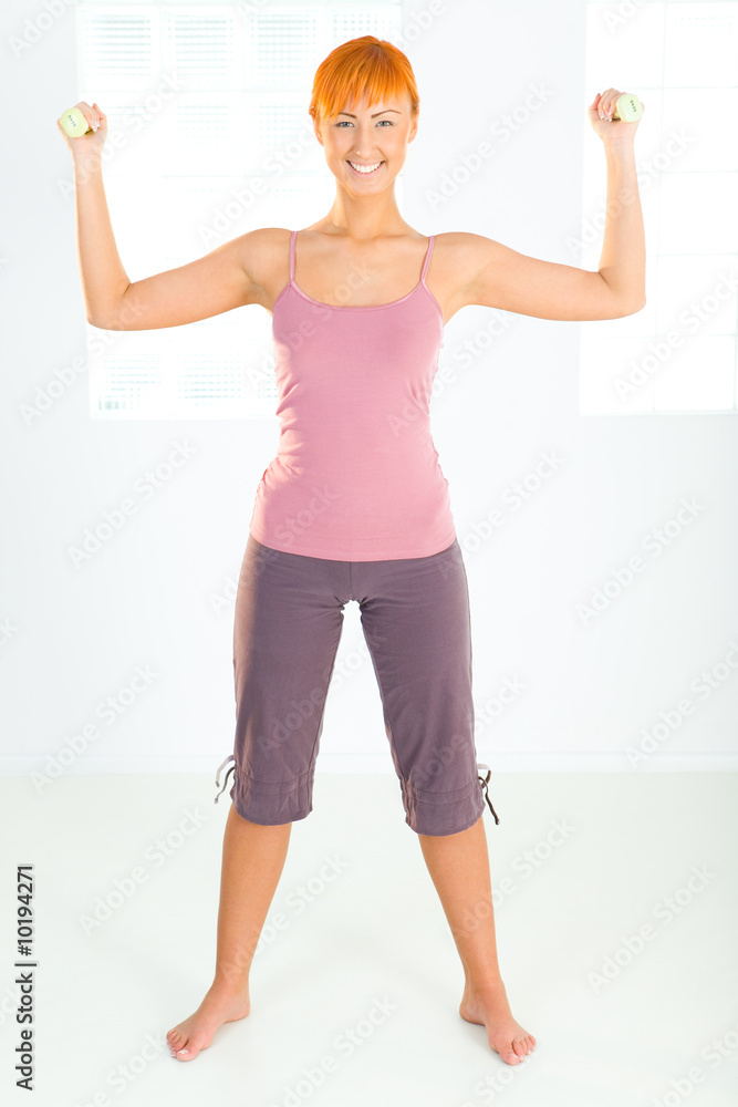 Fototapeta premium Young woman during workout