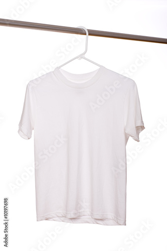 A white blank t-shirt hanging in front of a white background