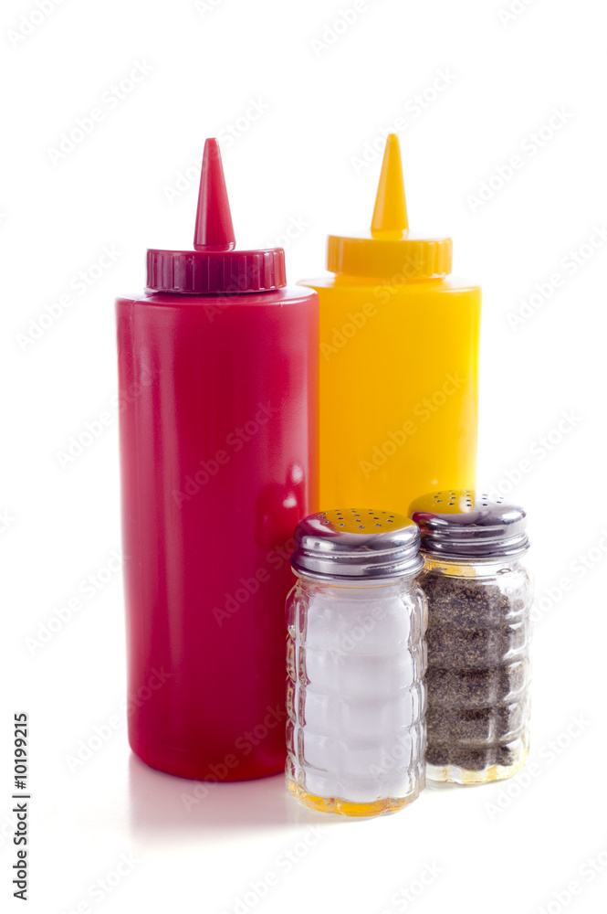 A cafe or restaurant tabletop setup with ketchup and mustard A cafe or restaurant tabletop setup with ketchup and mustard