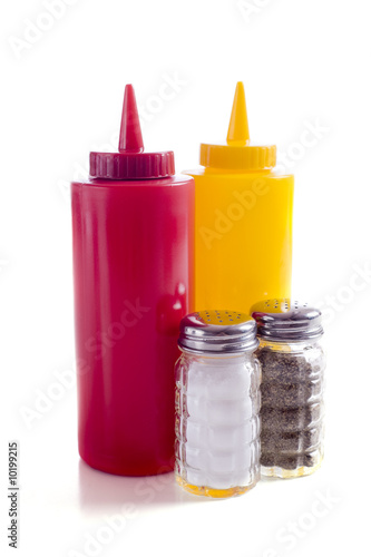 A cafe or restaurant tabletop setup with ketchup and mustard