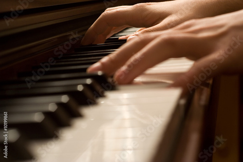 Pianists' hand playing the piano