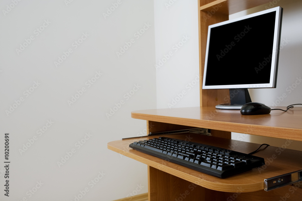 Modern new computer on a wooden table Modern new computer on a wooden table