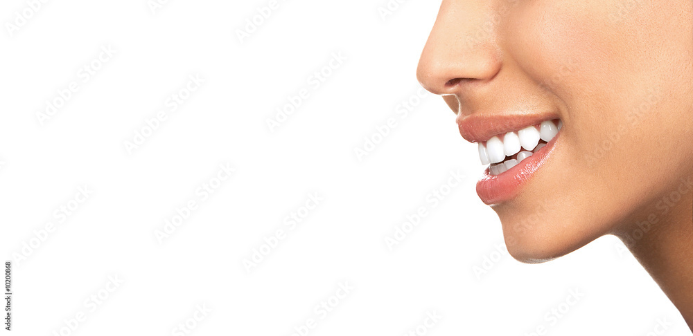 Fototapeta premium Beautiful young woman teeth. Isolated over white background.