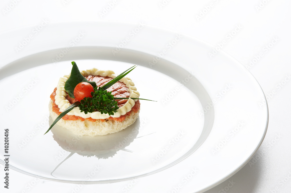 Single snack on white dish Single snack on white dish