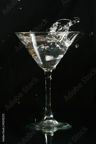 martini splash on black background close up