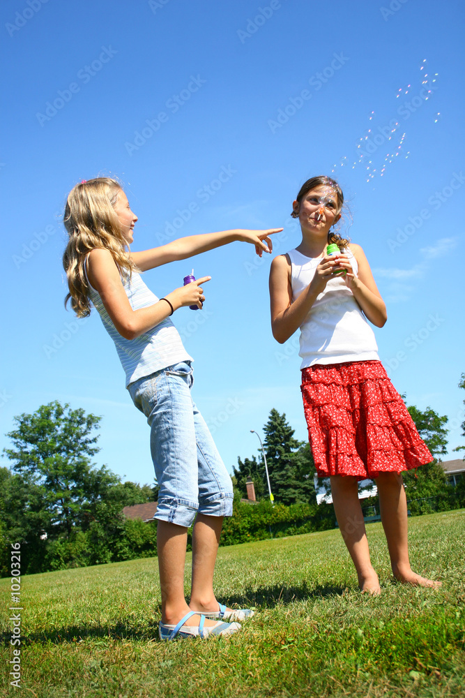 Fototapeta premium Teen doing soap bubbles