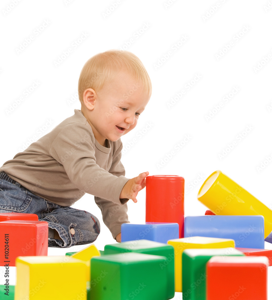 little boy play with bricks. isolated on a white background little boy play with bricks. isolated on a white background