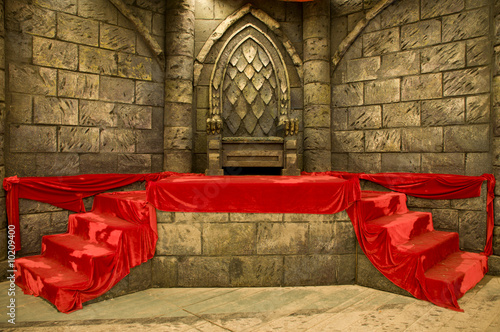 Empty middle-age royal throne with red velvet