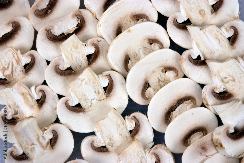 A background of chopped buttton mushrooms A background of chopped buttton mushrooms