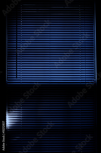 deep rich blue image of mini blinds covering window