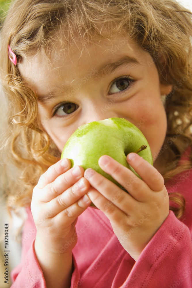 child with green apple child with green apple