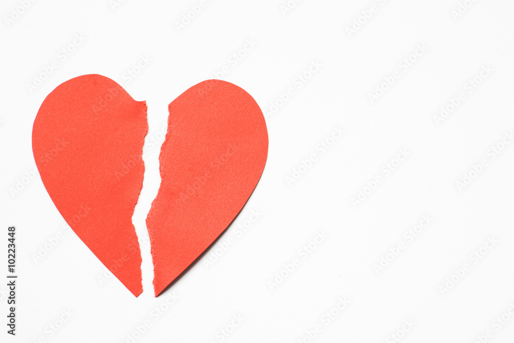 Red Paper Heart Torn In Half Against White Background
