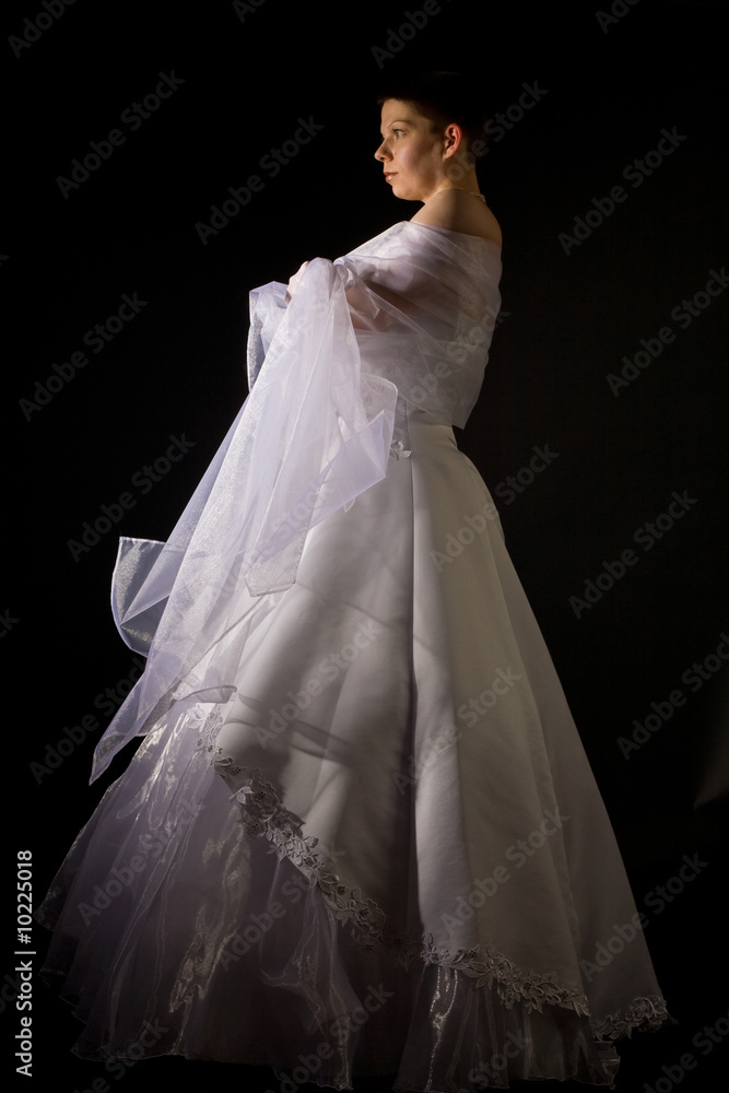 fiancee in the white bridal dress over black background fiancee in the white bridal dress over black background