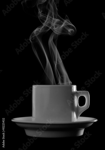 Cup of hot drink with steam isolated over black background