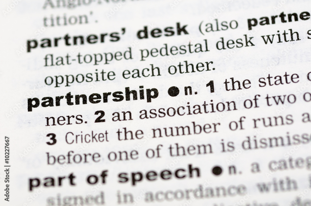 A close up of the word partnership from a dictionary
